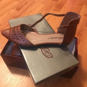 Cognac flats that strap around ankle